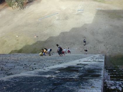 Tiny figures on the black ash of a volcano