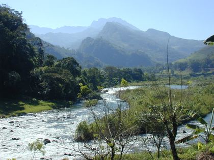 A clear river winding through the green mountains