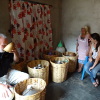Tasting Do&ntilde;a Angela's mezcal from the black clay storage jugs.