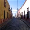 A narrow cobblestone road in Queretaro