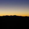 The promise of a sunrise brings out the silhouette of the mountain ranges in Mil Cubres (Thousand Peaks).