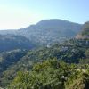 The road winds around the mountains towards Taxco.